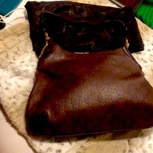 Authentic Gucci brown with gold hardware shoulder bag with storage bag. GUC